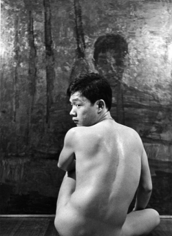 Paul posing with Victorio Edades painting of
