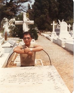 Paul by the grave of Frank Harris in Nice, mid-1980s.