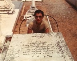 Paul by the grave of Frank Harris in Nice, mid-1980s.