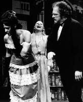Middle Frank abuses his first wife in 1980 Lawrence production.