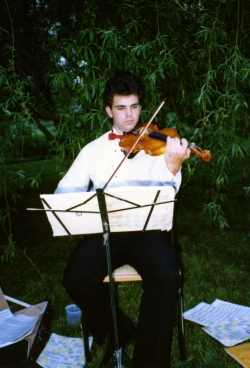A cellist providing background music at one of Paul's garden parties.