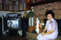 Mom in living room of house, early 1990s.