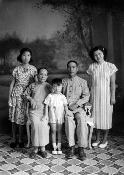 Paul and Mom with Mom's family in China, 1948.