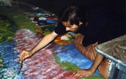 Jim Erdahl painting the backdrop for Two from the Hurt, 1989.