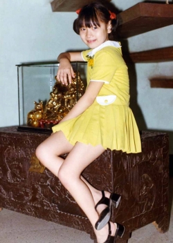 Debbie underneath staircase in Sta. Mesa house, early 1970s.