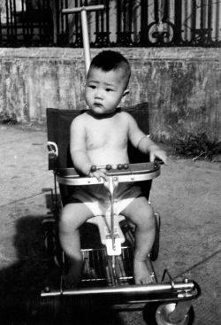 Brother John outside rental house on Tennessee St., 1955.
