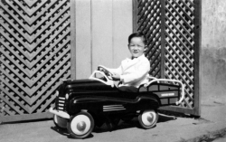 Paul outside house in Chinatown, 1949.