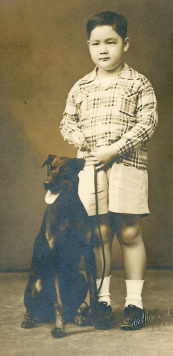 Paul with Pop's dog, early 1950s.